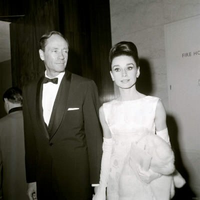 Mel Ferrer and Audrey Hepburn, holding a Fur Coat, British Film Academy Awards, April 1964