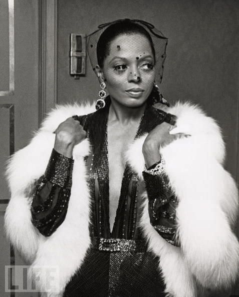 Diana ross in a white fur and plunging neckline makes a timeless fashion statement Diana ross in a white fur and plunging neckline makes a timeless fashion statement