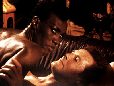 Grace Jones & Roger Moore, appeared together in 'A View to Kill'