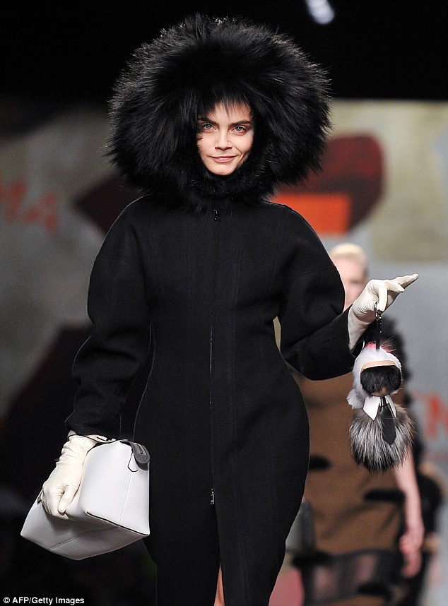 Cara Delevingne strutting with Karl Lagerfeld's Karlito - Fendi - Fall 2014-Winter 2015