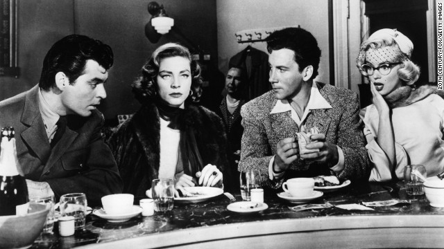 Rory Calhoun, Lauren Bacall, Cameron Mitchell, and Marilyn Monroe sitting in diner in a scene from the film 'How To Marry A Millionaire', 1953. (Photo by 20th Century-Fox/Getty Images)