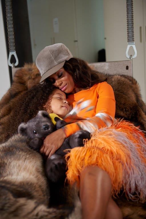 Appearing in the December Elle Decor ad, June is seen lounging in luxury with her daughter after an exhausting fashion-filled day.