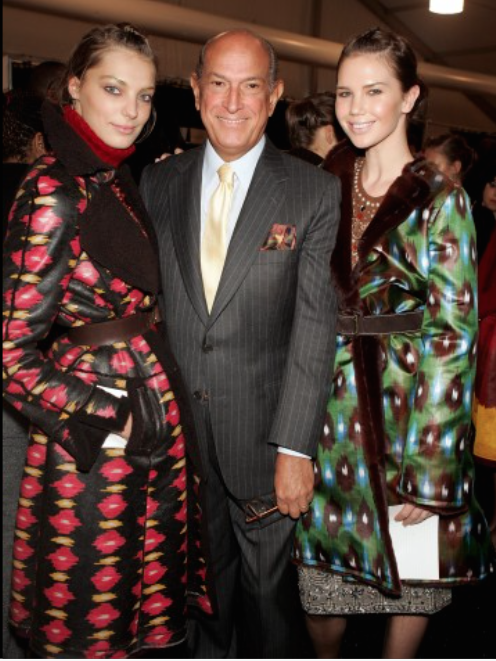 Oscar de la Renta backstage with models during his fall 2005 fashion show during Olympus Fashion Week in New York