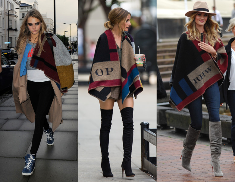 Burberry Prorsum poncho from their fall 2014 seen here worn by (L to R) Cara Delevingne, Olivia Polermo, Rosie Huntington-Whiteley