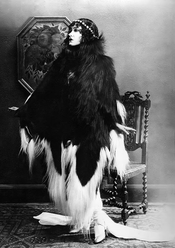 Gloria Swanson vamping in a black and white monkey fur coat, 1920s