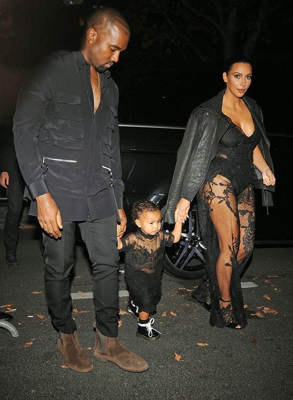 Kim Kardashian and Kanye West with North at the Givenchy fashion show in Paris
