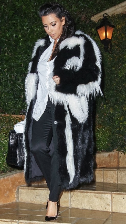 Kim Kardashian wearing a skunk style fur coat