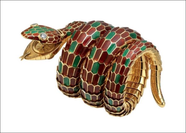 “Serpenti” bracelet-watch in gold with red and green enamel and diamonds, ca. 1965. Bulgari Heritage Collection Photo: Antonio Barrella, Studio Orizzonte Roma