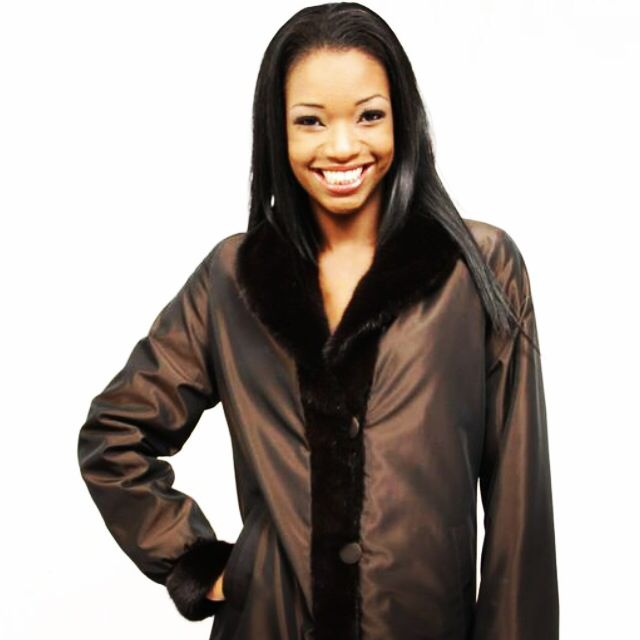 An example of a sheared mink reversible all-weather coat