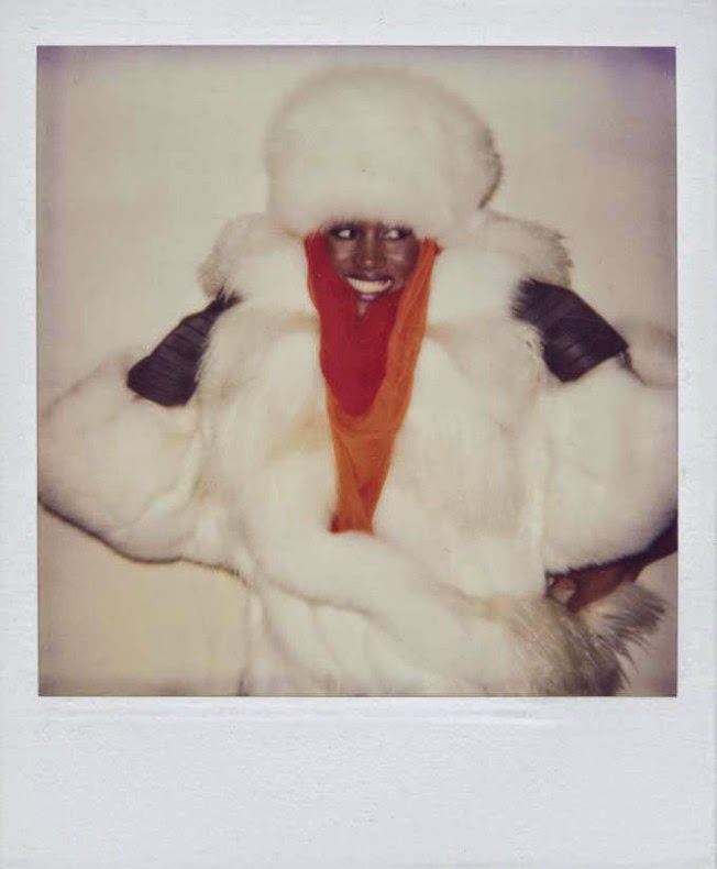 Grace Jones draped in fur. Polaroid by Andy Warhol