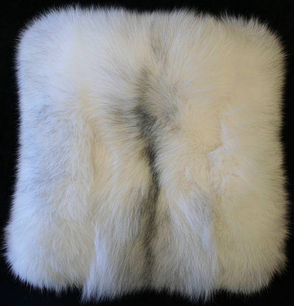 A restyle project. This is a white fox pillow made from an coat