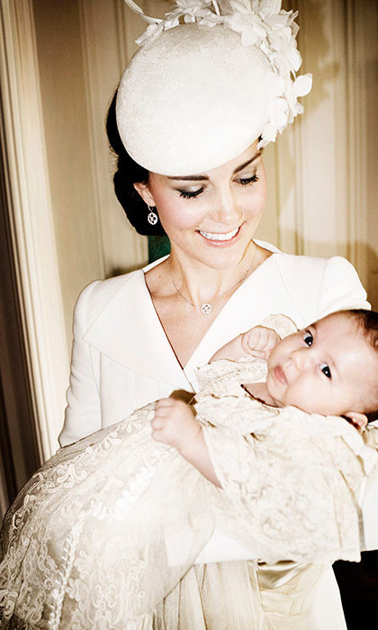 Dutchess Kate holding 2-month-old Princess Charlotte at her baptism in 2015