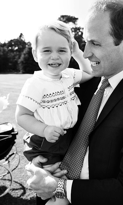 Prnce George with his father Prince WIlliam on the day of his sister's babtism