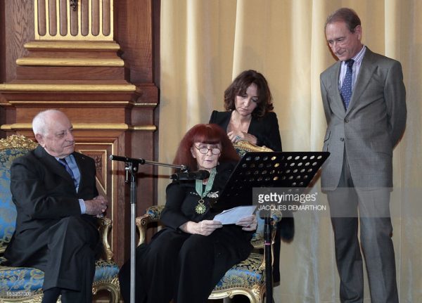 2012 French fashion designer Sonia Rykiel (C), next to her daughter Nathalie Rykiel (2nd R) speaks after awarded Commandeur of the Arts and Letters order by French businessman Pierre Berge (L) and received the medal of the city of Paris 