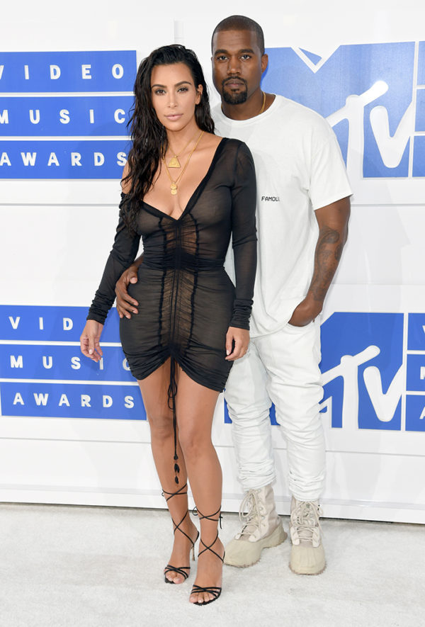 Kim Kardashian and Kanye West in Yeezy. We're not surprised at the sexy look Kim pulled off, but rather that her look was simple yet stunning from head to toe