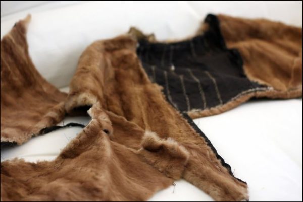 A vintage mink coat in the process of being upcycled and restyled into a mink capelet