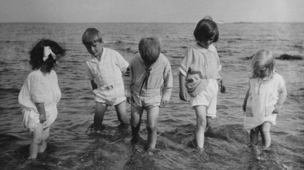 Children from 1924 getting their final splash in wearing their summer whites