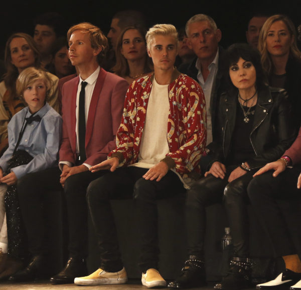 Musicians Beck (L), Justin Bieber (C) and Joan Jett watch the Saint Laurent fall collection during a fashion show at the Hollywood Palladium in Los Angeles, California February 10, 2016. REUTERS/Mario Anzuoni