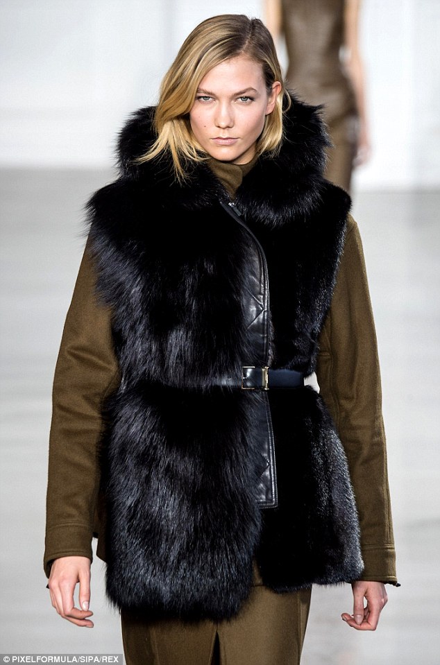 Modern and sexy Karlie Kloss embodied the All-American girl while walking the runway in a green dress and fur jacket at the Jason Wu Fall 2015 Show