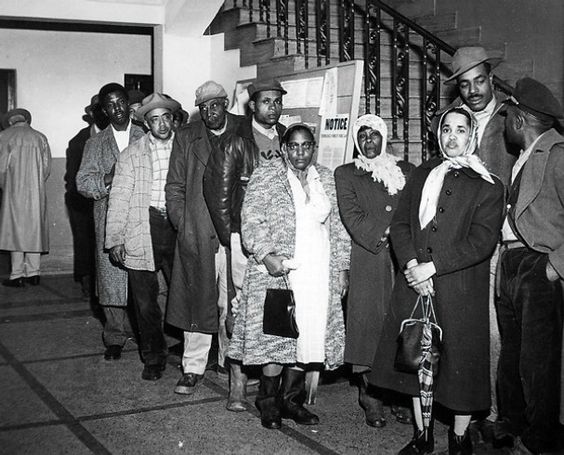 The Voting Rights struggle of Black Sharecroppers in the 1950s and 1960s. | Photo: People waiting in line for hours to register to vote while enduring the taunts of onlookers.