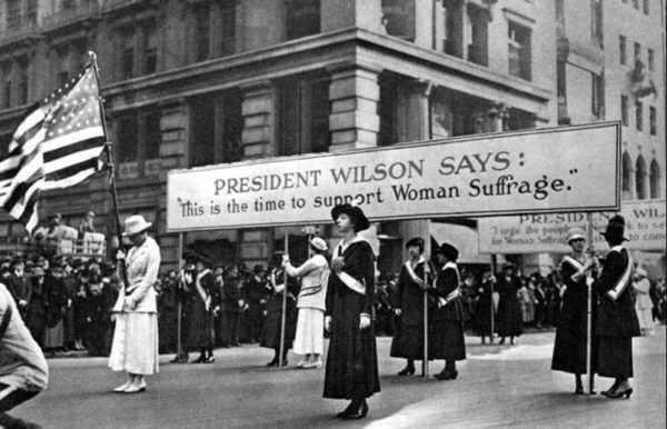 Women suffragists march for the right to vote during the presidency of Woodrow Wilson. 