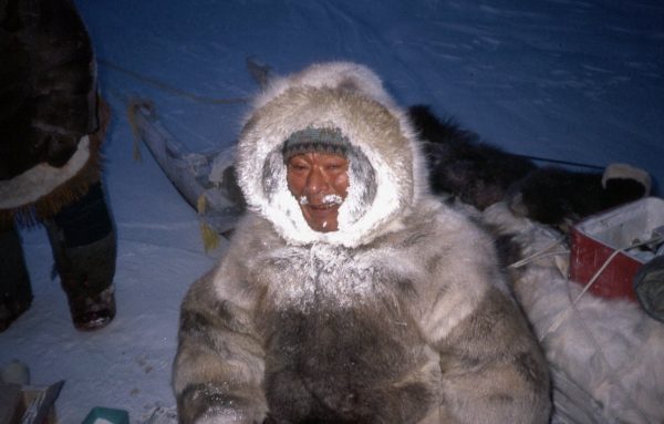 Frozen breath commonly encrusts the hood of the parka. Where wolverine fur is available it may be used to trim the hood since it repels moisture.