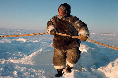 Inuit Hunter dressed in traditional fur clothing - Canadian Eastern Arctic