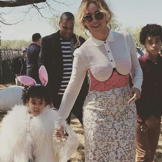 Beyonce, Jay Z, Blue Ivy (wearing a Mongolian lamb jacket from Adrienne Landau) on Easter Sunday 2016