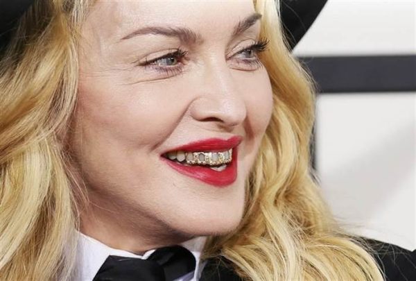 56 year old Madonna rocking a gold grill at the 2015 Grammy Awards. Age Appropriate style