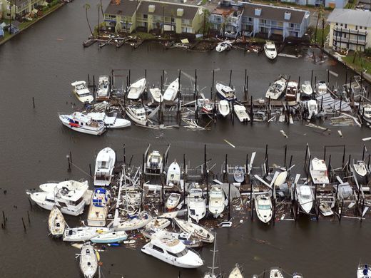 Damaged boats along a dock in the wake of Hurricane Harvey