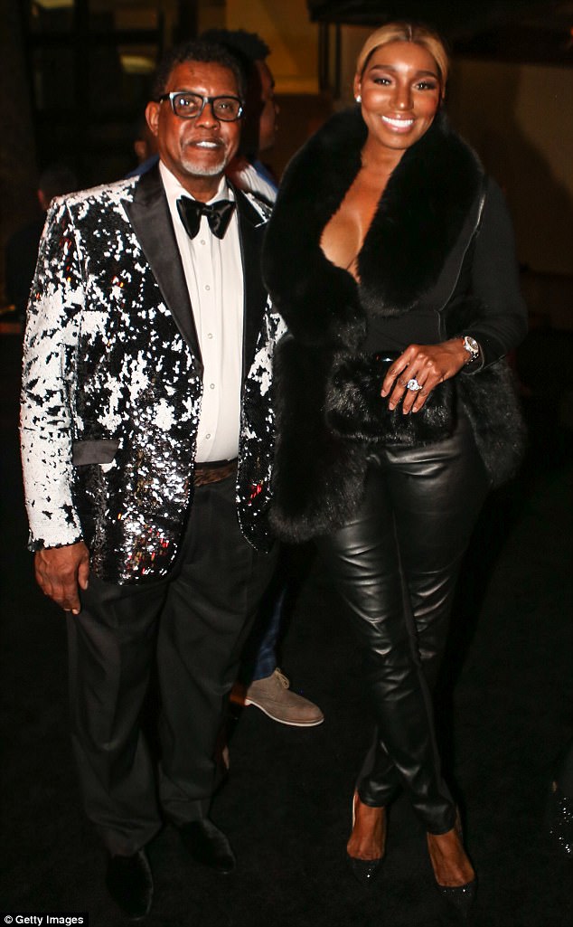 Real Housewives of Atlanta star Nene Leakes rocked a black leather ensemble with matching fur coat, while her and her husband Greg attended Diddy's NYE party celebrity style 