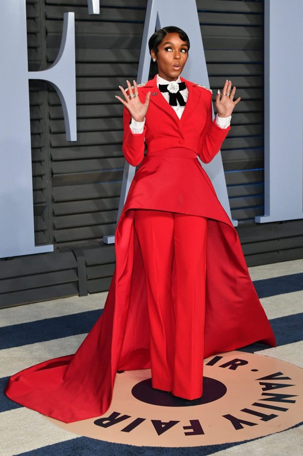 Always a red carpet rogue, singer janelle Monae made a strong statement in her Christian Siriano lipstick red tux with exaggerated train at the 2018 Oscars