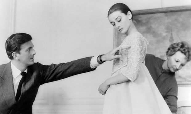 Hubert de Givenchy with Audrey Hepburn in his Paris workshop. Photograph: Sunset Boulevard/Corbis/Getty Images