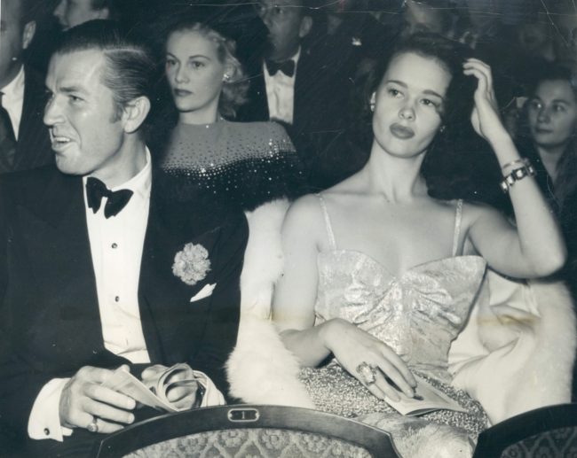 Bruce Cabot and Gloria Vanderbilt attend a theater in Hollywood November 29, 1941