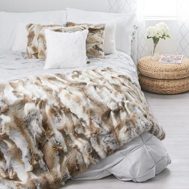 A natural brown rabbit throw and matching pillows from Fur Source create a perfect personalized space for relaxation in home decor