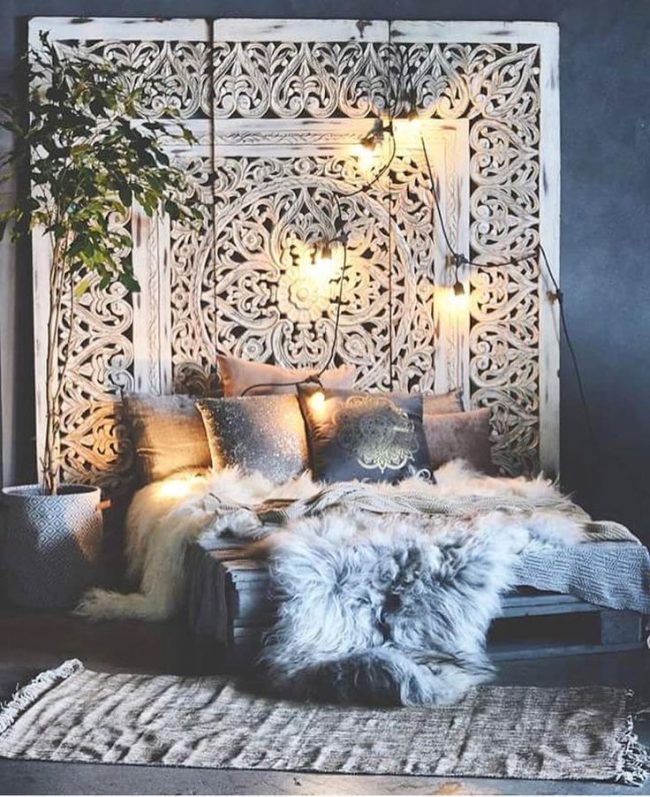 dramatic boho styled bedroom accented with fur throw home decor